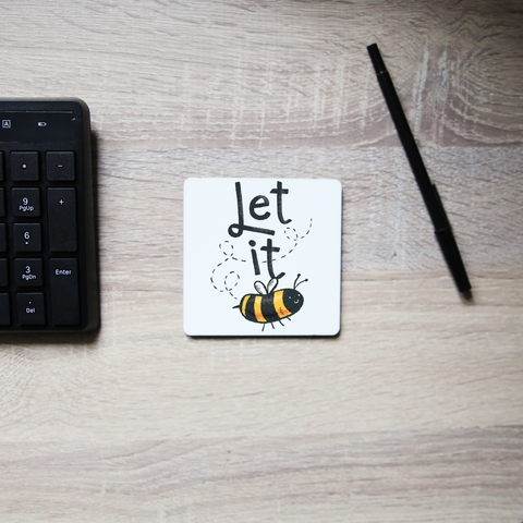 T-shirt design featuring a cute bee illustration with the words LET IT on top of it, forming LET IT BEE coaster drink mat - Graphic Gear